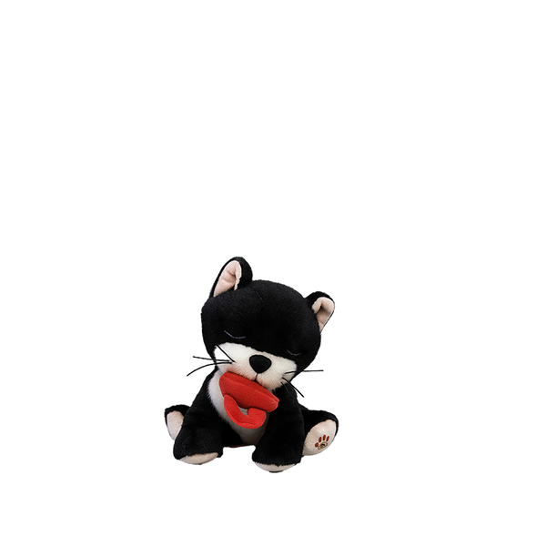 Black and white plush toy with a red pacifier on a white background