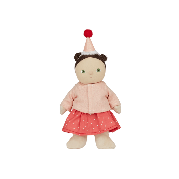 Stuffed doll with pink outfit and hat on a white background