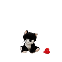 Black and white plush toy cat with a red object on a white background