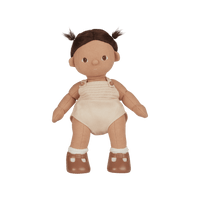 Plush baby doll with brown hair, beige romper, and brown shoes on a white background