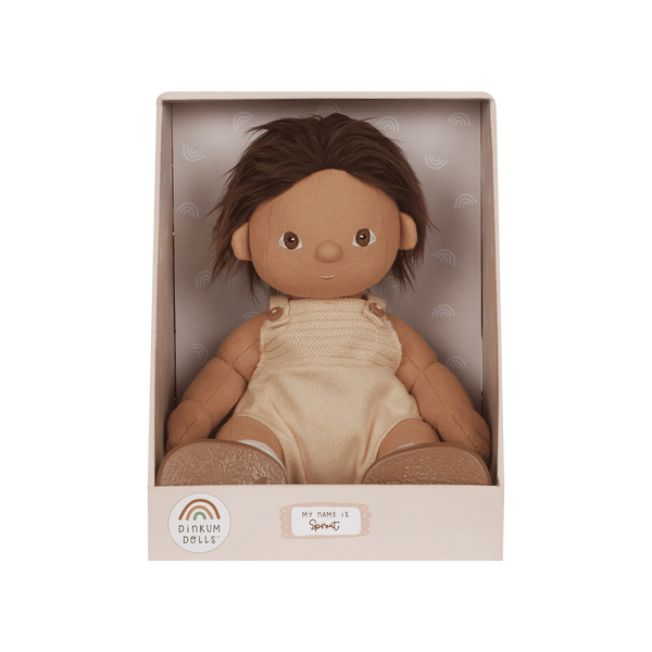 Doll in a beige box with a label on a white background