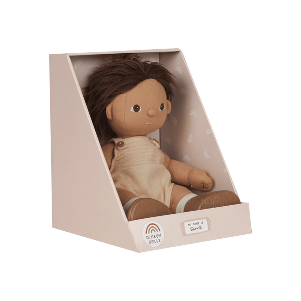 Doll in a beige box with a white background
