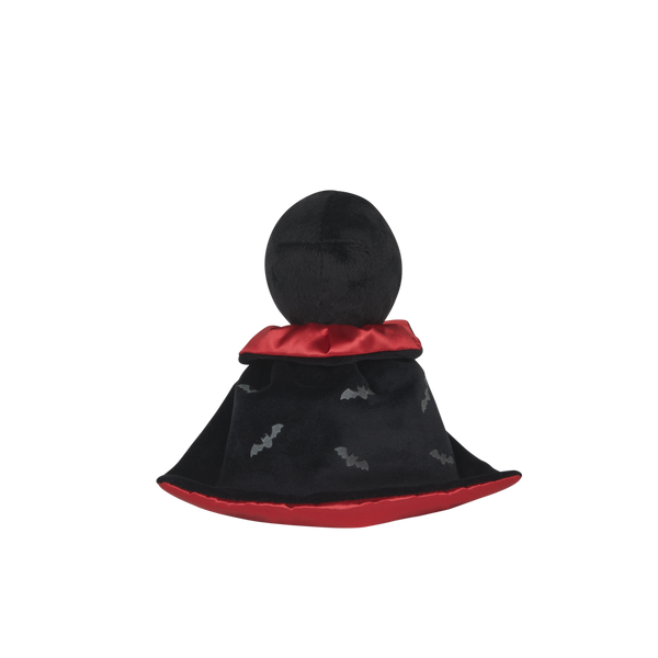 Stuffed toy with a black hood and red trim on a white background