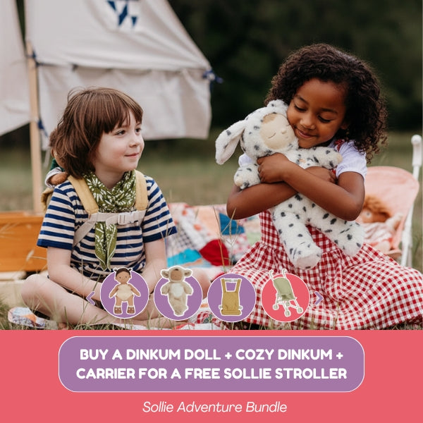 Two children sitting outdoors with a Dinkum Doll and Cozy Dinkum, promotional text for Sollie products.