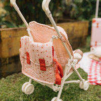 Olli Ella pink strawberry print Doll changing mat and bag with matching strawberry doll stroller.