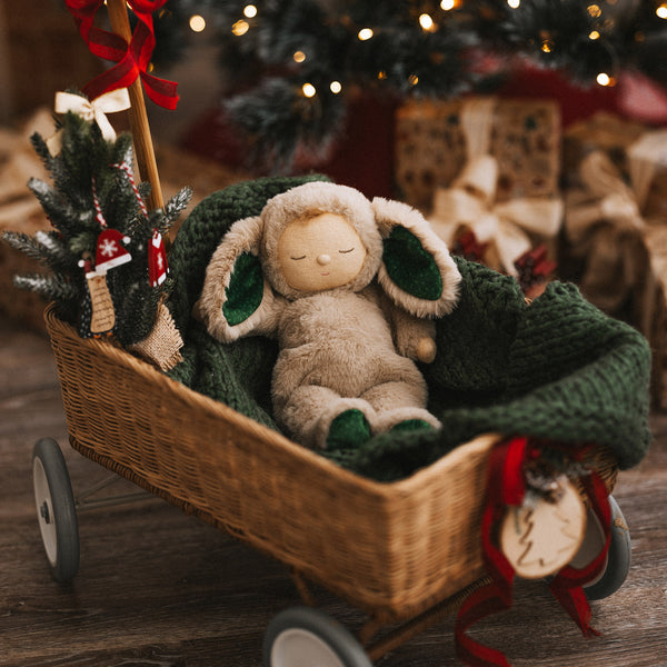 Olli Ella Christmas themed Cozy Dinkum Bunny with green features and Rattan Wagon