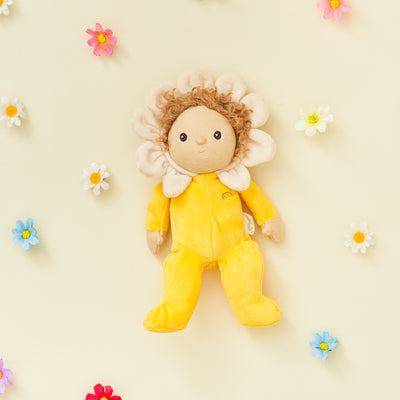 Olli Ella Blossom Buds Dinky Dinkum Daisy Yellow Flower Doll laying with flowers