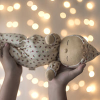 Olli Ella Christmas theme Dozy Dinkum with cream print with fairy light background