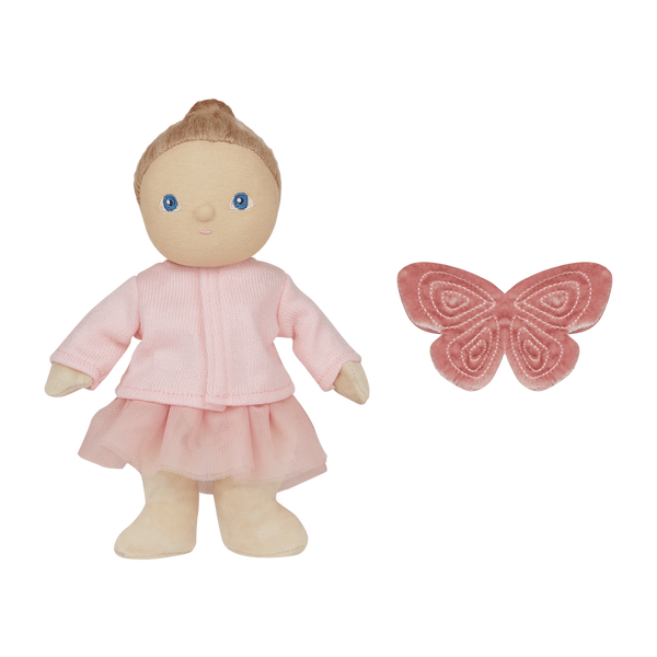 Doll in pink outfit with a butterfly toy on a white background
