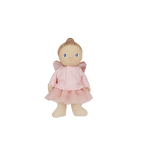 Stuffed doll with a pink outfit on a white background