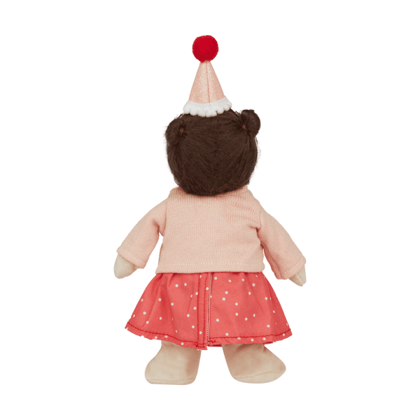 back of a doll with hat, pink cardigan and spot dress